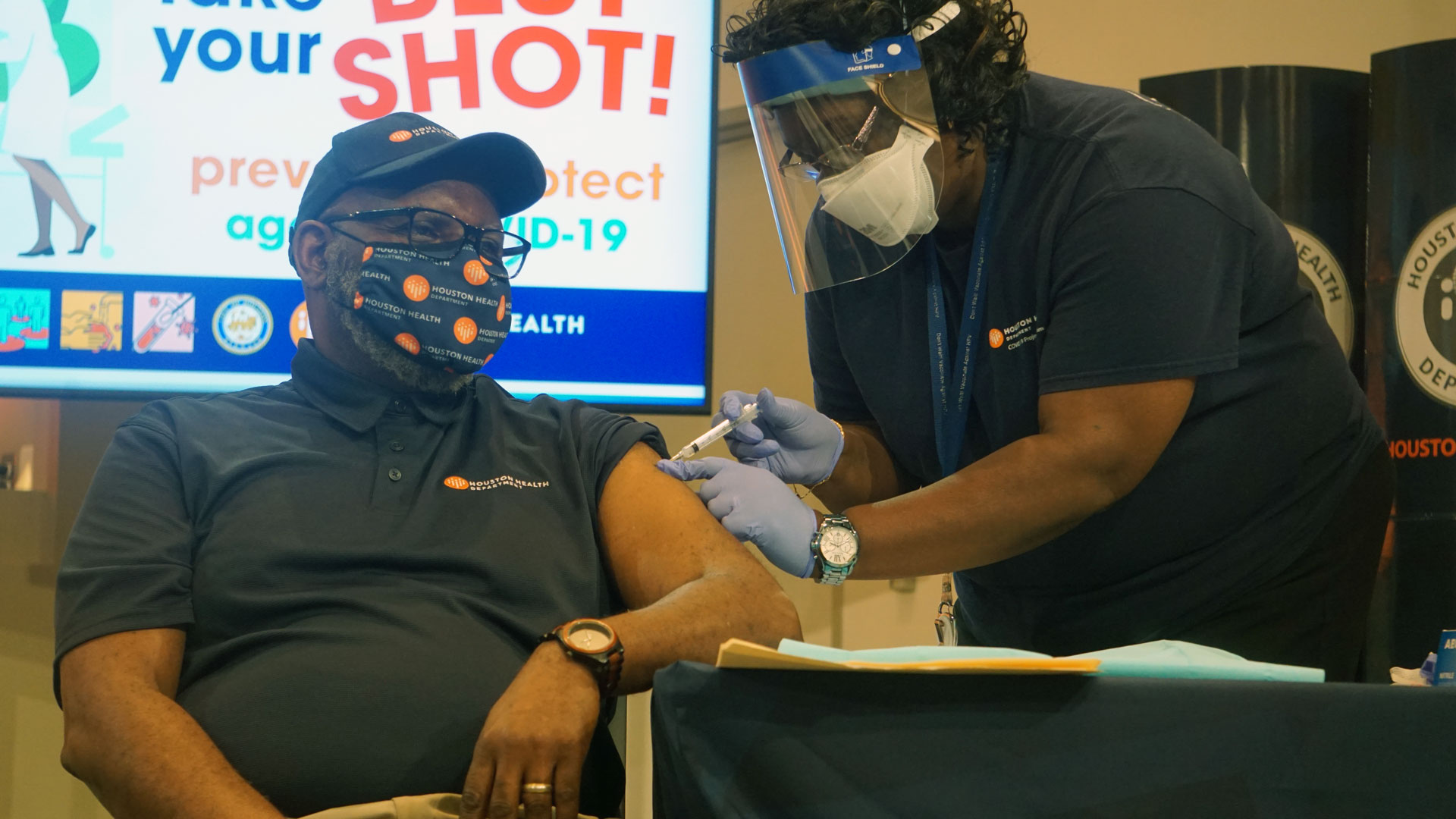 Image of person getting COVID-19 vaccination.